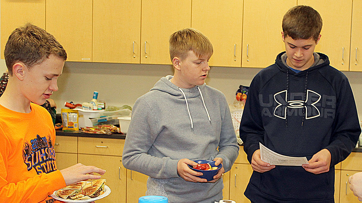 Team members describe their dish, ingredients